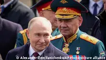 Russian President Vladimir Putin, left and Russian Defense Minister Sergei Shoigu, right, leave Red Square after the Victory Day military parade in Moscow, Russia, Thursday, May 9, 2024, marking the 79th anniversary of the end of World War II. (AP Photo/Alexander Zemlianichenko)