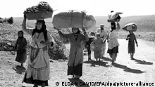 A handout picture provided by the Israeli Goverment Press Office on 04 May 2008 shows Arabs fleeing with just the possessions they are able to carry as they make their way toward Lebanon from villages in the Galilee during Israel's 1948 War of Independence. During the 1948 war Arabs fled to Lebanon, to Jordan, into the West Bank areas, and the Gaza Strip and became refugees in what they refer to as the 'Nakba,' or the catastrophy. Israel celebrates its 60th anniversary on May 14, according to the internationally-used Gregorian calendar; on May 8, according to the Hebrew calendar. EPA/ELDAN DAVID EDITORIAL USE ONLY +++ dpa-Bildfunk +++
