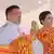 Thailand's King Vajiralongkorn sits next to Queen Suthida at a royal plowing ceremony in Bangkok.
