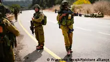 Israeli soldiers patrol along a road near the border between Israel and Lebanon, in Israel, Monday, Oct. 16, 2023. (AP Photo/Francisco Seco8