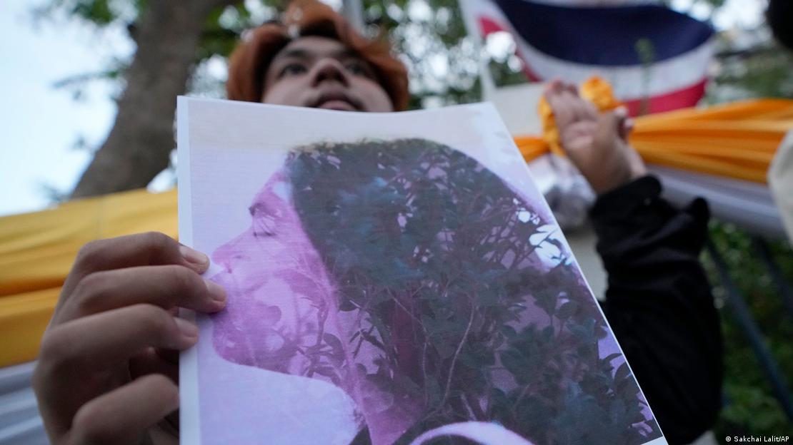 A Thai activist holds a portrait of Netiporn Sanesangkhom, a member of the activist group Thaluwang, known for their bold and aggressive campaigns demanding reform of the monarchy and abolition of the law that makes it illegal to defame members of the royal family outside of criminal court in Bangkok, Thailand, on May 14, 2024. 