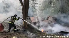 KHARKIV, KHARKIV OBLAST, UKRAINE - MAY 14: (----EDITORIAL USE ONLY Äì MANDATORY CREDIT - 'STATE EMERGENCY SERVICE OF UKRAINE / HANDOUT' - NO MARKETING NO ADVERTISING CAMPAIGNS - DISTRIBUTED AS A SERVICE TO CLIENTS----) Rescuers extinguish a fire following Russian missile attack in Kharkiv, Ukraine on May 14, 2024. Russia launched airstrikes on residential quarters in various areas of the city. The attacks destroyed a building's structure, damaged nearby buildings and caused fires. More than 80 rescuers and 15 units took part in relief efforts. State Emergency Service of Ukraine / Handout / Anadolu