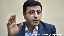 Selahattin Demirtas, co-leader of Turkey's pro-Kurdish People's Democratic Party (HDP), speaks during an interview with AFP in Brussels on August 6, 2015. Demirtas urged the world to denounce Ankara's new unjust war on rebel Kurds and asked the EU to push clearly for a truce. AFP PHOTO / JOHN THYS (Photo credit should read JOHN THYS/AFP via Getty Images)