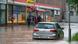 Passersby trudge and drive through floodwaters on Fischbachstrasse in Saarbrücken, Germany Passersby trudge and drive through floodwaters on Fischbachstrasse in Saarbrücken, Germany