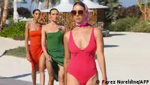 A model present creations from the summer beachwear collection by Moroccan designer Yasmina Q, during the Red Sea Fashion Week in Saudi Arabia's Red Sea resort of Ummahat Island on May 17, 2024. (Photo by Fayez Nureldine / AFP)