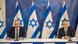 Benny Gantz e Benjamin Netanjahu, com bandeiras de Israel ao fundo Benny Gantz e Benjamin Netanjahu, com bandeiras de Israel ao fundo
