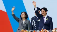 Taiwan's former President Tsai Ing-wen and new President Lai Ching-te wave to people during the inauguration ceremony outside the Presidential office building in Taipei, Taiwan May 20, 2024. REUTERS/Carlos Garcia Rawlins