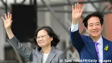 Taiwan's President Lai Ching-te (R) waves alongside outgoing president Tsai Ing-wen during the inauguration ceremony at the Presidential Office Building in Taipei on May 20, 2024. (Photo by Sam YEH / AFP) (Photo by SAM YEH/AFP via Getty Images)