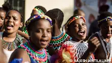 Young women dressed up in traditional attire sing and chant during an audition organised by the Indoni Culture School in the South African city of Durban, on May 25, 2019, on the occasion of Africa Month, a month that sees Africans on the continent showcasing the diaspora of cultural activities, film, music and food. May 25th marks Africa Day, an annual commemoration during Africa Month that intends to uphold greater unity and solidarity between African countries, and also strives for accelerated political and socio-economic integration of the continent. (Photo by Rajesh JANTILAL / AFP)