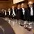 Los jueces que ven la causa contra Israel ingresan al tribunal.