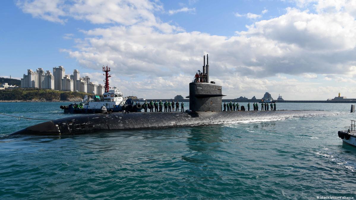 Tugboats assist the Los Angeles-class fast-attack submarine USS Key West (SSN 722) as it prepares to moor in Busan, South Korea