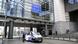 Belgian police stand near their van in front of the European Parliament building on May 29, 2024. Belgian police stand near their van in front of the European Parliament building on May 29, 2024.