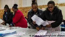 Election volunteers count ballots at Craighall Park Elementary school in Johannesburg, South Africa, Wednesday May 29, 2024. (AP Photo/Jerome Delay)