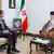 Bashar Assad and Ali Khamenei sit next to a portrait of Ebrahim Raisi in Tehran on May 30