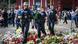 Police officers lay down flowers at a makeshift memorial to local police officer Rouven L. on June 07, 2024 in Mannheim, Germany Police officers lay down flowers at a makeshift memorial to local police officer Rouven L. on June 07, 2024 in Mannheim, Germany
