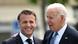 Biden has his arm around Macron's shoulder as the two stand together Biden has his arm around Macron's shoulder as the two stand together
