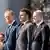 Donald Tusk, Olaf Scholz and Emmanuel Macron standing alongside each other