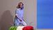 Giorgia Meloni walking onto a stage with flowers in the foreground the colors of the Italian flag Giorgia Meloni walking onto a stage with flowers in the foreground the colors of the Italian flag