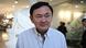 Thailand's former prime minister Thaksin Shinawatra walks out of a beauty salon in Bangkok Thailand's former prime minister Thaksin Shinawatra walks out of a beauty salon in Bangkok