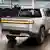 A silver Rivian pick-up truck seen from behind at a Plymouth, Michigan, manufacturing facility 