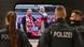 Three police officers and two Polish football fans wearing red Three police officers and two Polish football fans wearing red
