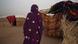 A Sudanese woman turns her back to the camera in a refugee camp in Chad A Sudanese woman turns her back to the camera in a refugee camp in Chad