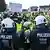 Police and anti-AfD demonstrators outside an AfD party conference in the city of Essen