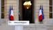 A podium in front of a building in Paris and two French flags and two EU flags A podium in front of a building in Paris and two French flags and two EU flags