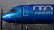 El morro de la aeronave, con el logo de la aerolínea, detrás de una valla del aeropuerto en Milán en una imagen de enero de 2024. El morro de la aeronave, con el logo de la aerolínea, detrás de una valla del aeropuerto en Milán en una imagen de enero de 2024.