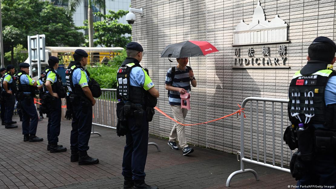 Police standing outside a court in Hong Kong
