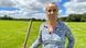 Woman standing on a field Woman standing on a field