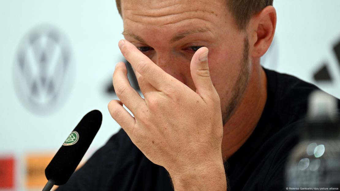 German national team coach Julian Nagelsmann covers his tears during a news conference, a day after the squad was eliminated from Euro 2024, in Herzzogenaurach, Bavaria on July 6th, 2024