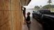Two men board up windows as they prepare for Beryl's arrival, Sunday, July 7, 2024, in Palaciios, Texas Two men board up windows as they prepare for Beryl's arrival, Sunday, July 7, 2024, in Palaciios, Texas