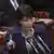 Takaichi gestures with her index finger while giving a speech in the Japanese parliament