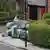 Forensic officers work outside a London property, after human remains were found in two suitcases in Bristol