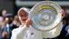 Athlete Barbora Krejcikova hoists a silver tablet (the Rosewater Dish) at Wimbledon's Center Court Athlete Barbora Krejcikova hoists a silver tablet (the Rosewater Dish) at Wimbledon's Center Court