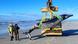 A rare spade-toothed whale is brought ashore after stranding on a beach in the Otago region of New Zealand A rare spade-toothed whale is brought ashore after stranding on a beach in the Otago region of New Zealand