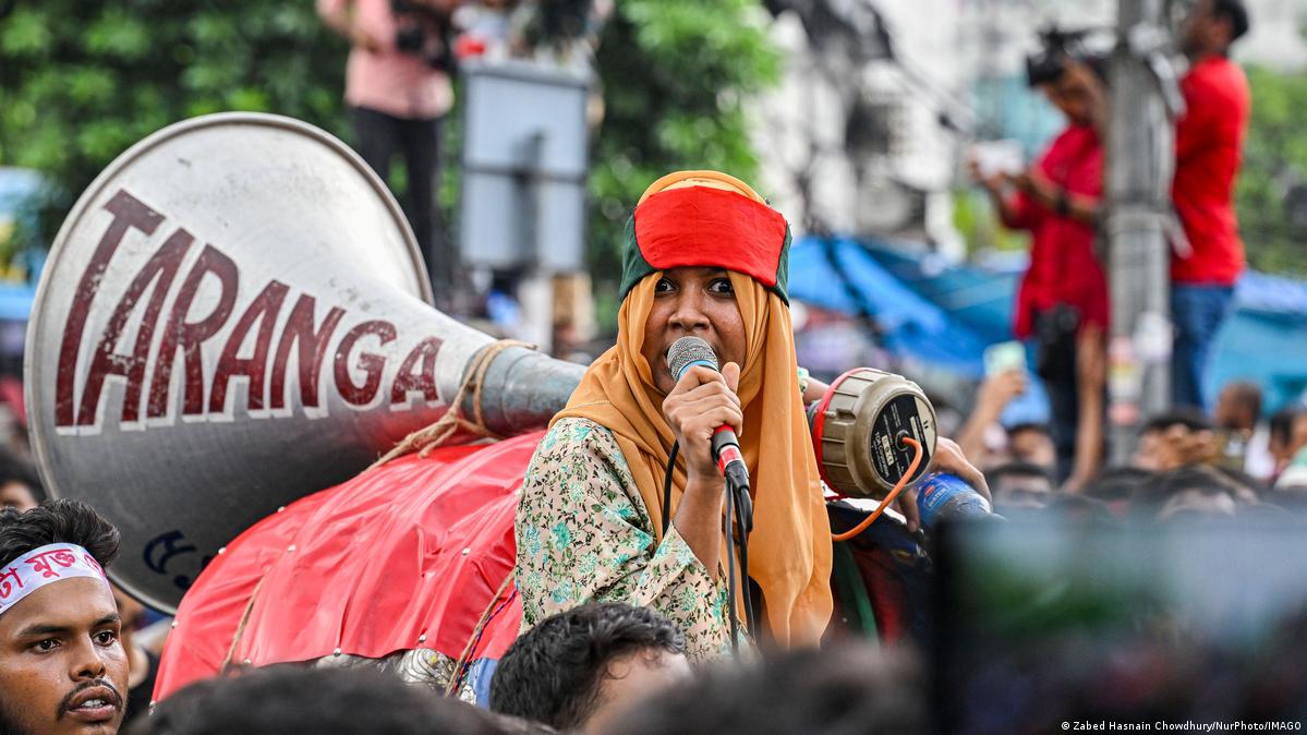 A student speaks into a megaphone at a protest rally in Dhaka against quota regulations in Bangladesh. A student speaks into a megaphone at a protest rally in Dhaka against quota regulations in Bangladesh.