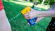 Hands holding a sunscreen spray bottle Hands holding a sunscreen spray bottle