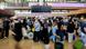 Numerous passengers are waiting in front of a black display board at the capital's BER airport. Numerous passengers are waiting in front of a black display board at the capital's BER airport.