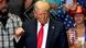 Trump making a fist during at a campaign event Trump making a fist during at a campaign event