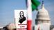 A sign with the slogan "woman, life, freedom," and an Iranian flag are visible in front of the US Capitol A sign with the slogan "woman, life, freedom," and an Iranian flag are visible in front of the US Capitol