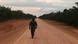 A man walks down an unpaved stretch of highway BR-319 in the Brazilian Amazon between the cities of Manaus and Porto Velho A man walks down an unpaved stretch of highway BR-319 in the Brazilian Amazon between the cities of Manaus and Porto Velho