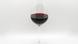 A glass of red wine against a white background A glass of red wine against a white background
