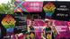 Two men dressed in rainbow shirts march at the Berlin Pride Parade in Berlin, holding up protest signs Two men dressed in rainbow shirts march at the Berlin Pride Parade in Berlin, holding up protest signs