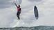 Brazilian surfer Gabriel Medina floats above the water on his surfboard after riding a wave off Tahiti. Brazilian surfer Gabriel Medina floats above the water on his surfboard after riding a wave off Tahiti.