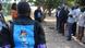 A group of campaigners wearing black T-shirts emblazoned with the message '22 years of quest for justice in vain' in front of the court building in Mubende A group of campaigners wearing black T-shirts emblazoned with the message '22 years of quest for justice in vain' in front of the court building in Mubende
