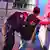 A police officer in Tijuana searches a man for drugs