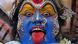 A portrait of an artist dressed as the Hindu goddess Mahakali performing during a procession of the Bonalu festival in Hyderabad. His face is colourfully painted, and he sticks out his red-painted tongue. A portrait of an artist dressed as the Hindu goddess Mahakali performing during a procession of the Bonalu festival in Hyderabad. His face is colourfully painted, and he sticks out his red-painted tongue.