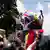 Opposition leader Maria Corina Machado waves a national flag during a rally in Caracas, Venezuela